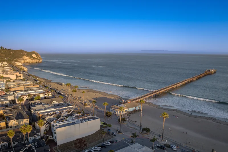 Avila Beach shoreline and pier in warm evening light.
